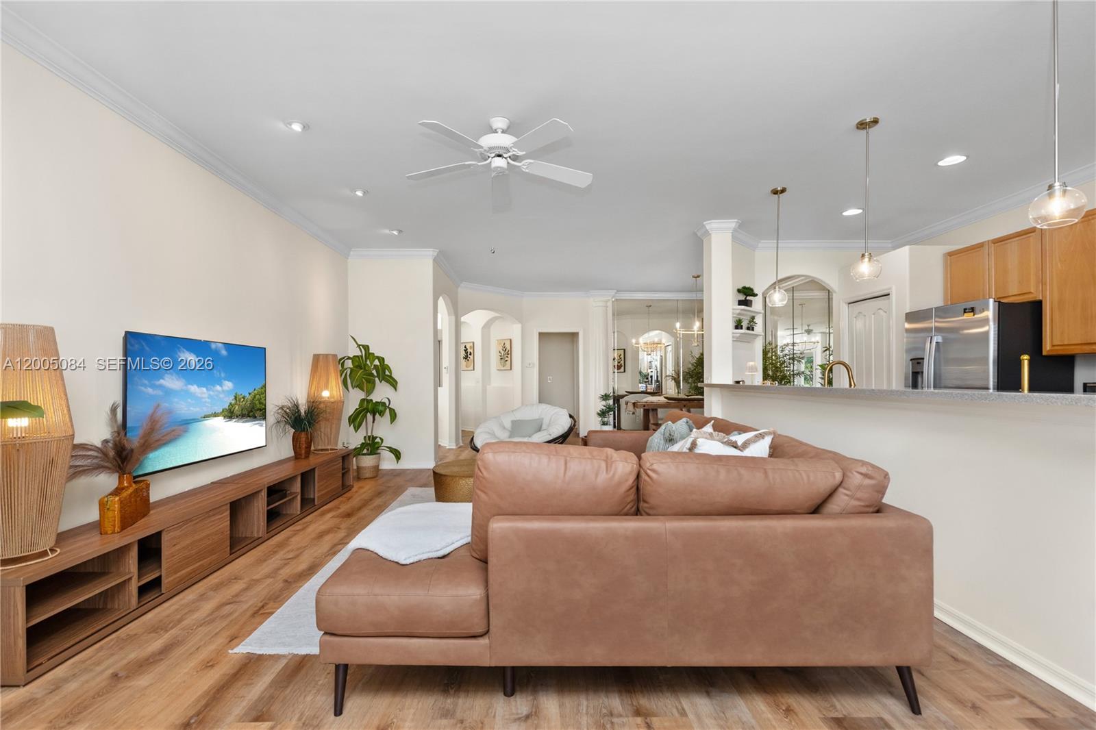 1896 Crestview Way Naples, FL 34119 - Photo 6 of 91 a living room with furniture and a flat screen tv