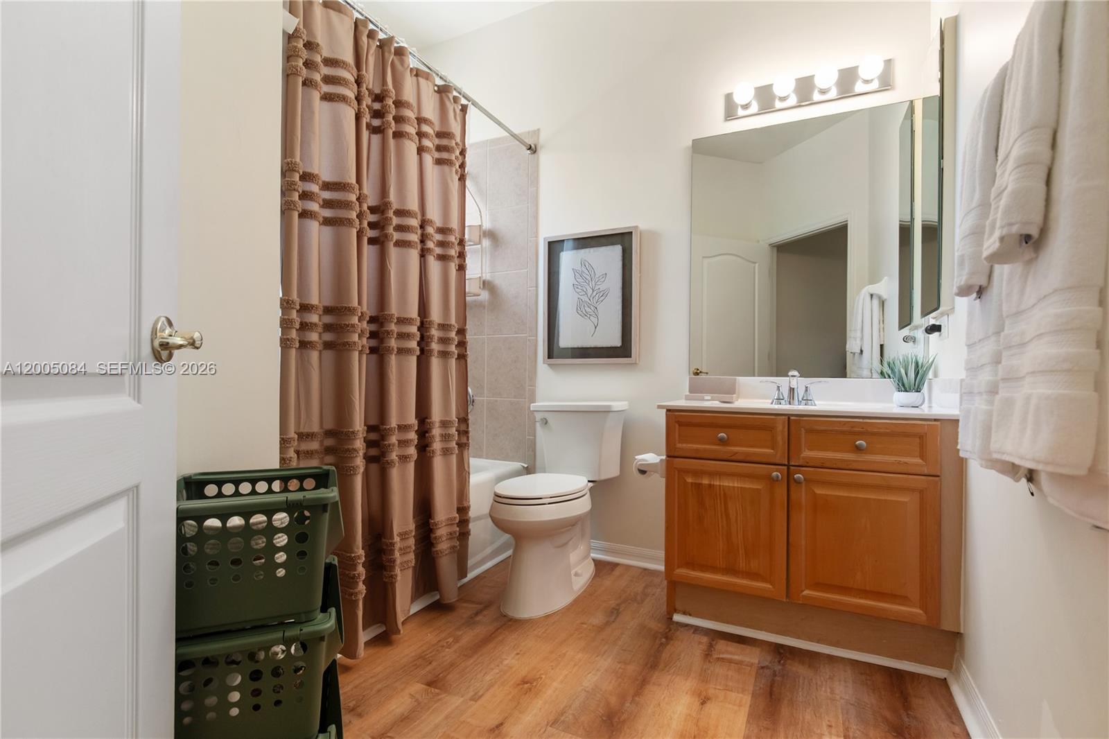 1896 Crestview Way Naples, FL 34119 - Photo 68 of 91 a bathroom with a toilet a sink and mirror