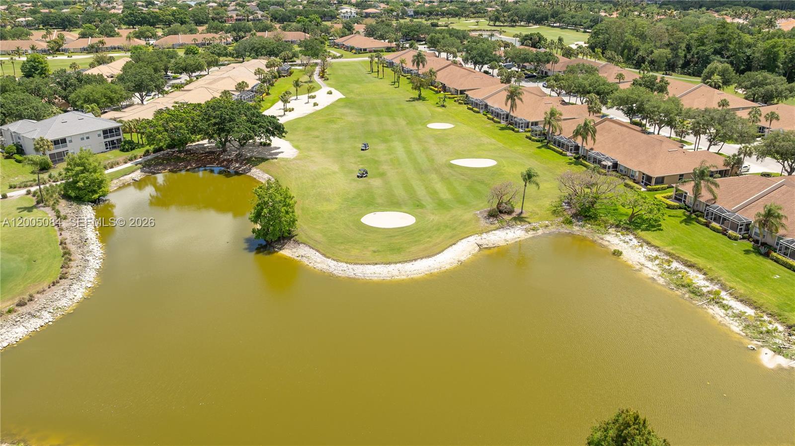1896 Crestview Way Naples, FL 34119 - Photo 90 of 91 an aerial view of residential houses with swimming pool and outdoor space
