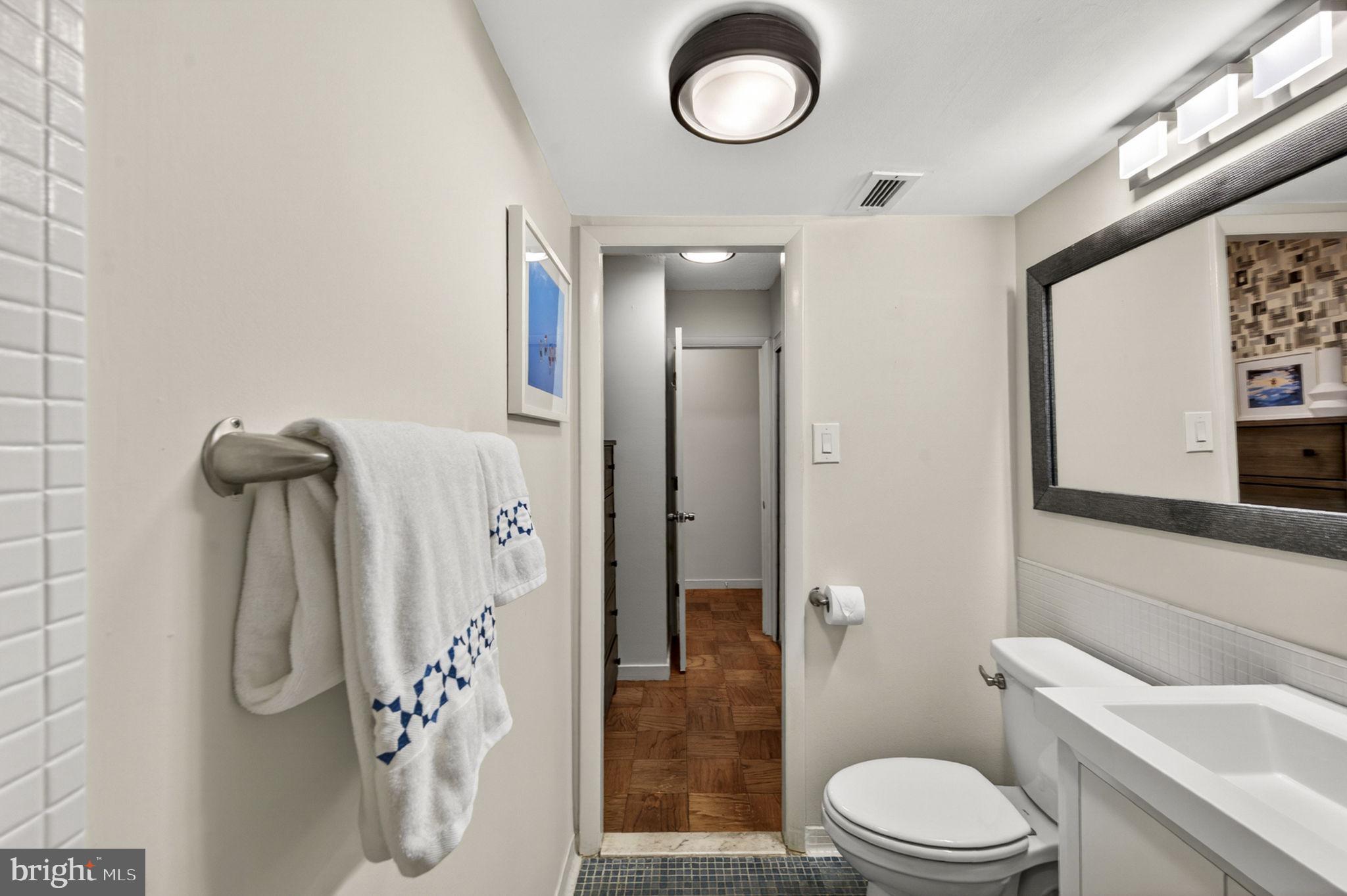 429 N Street Southwest, Unit S203 Washington, DC 20024 - Photo 17 of 28 a white toilet sitting next to a bathroom sink
