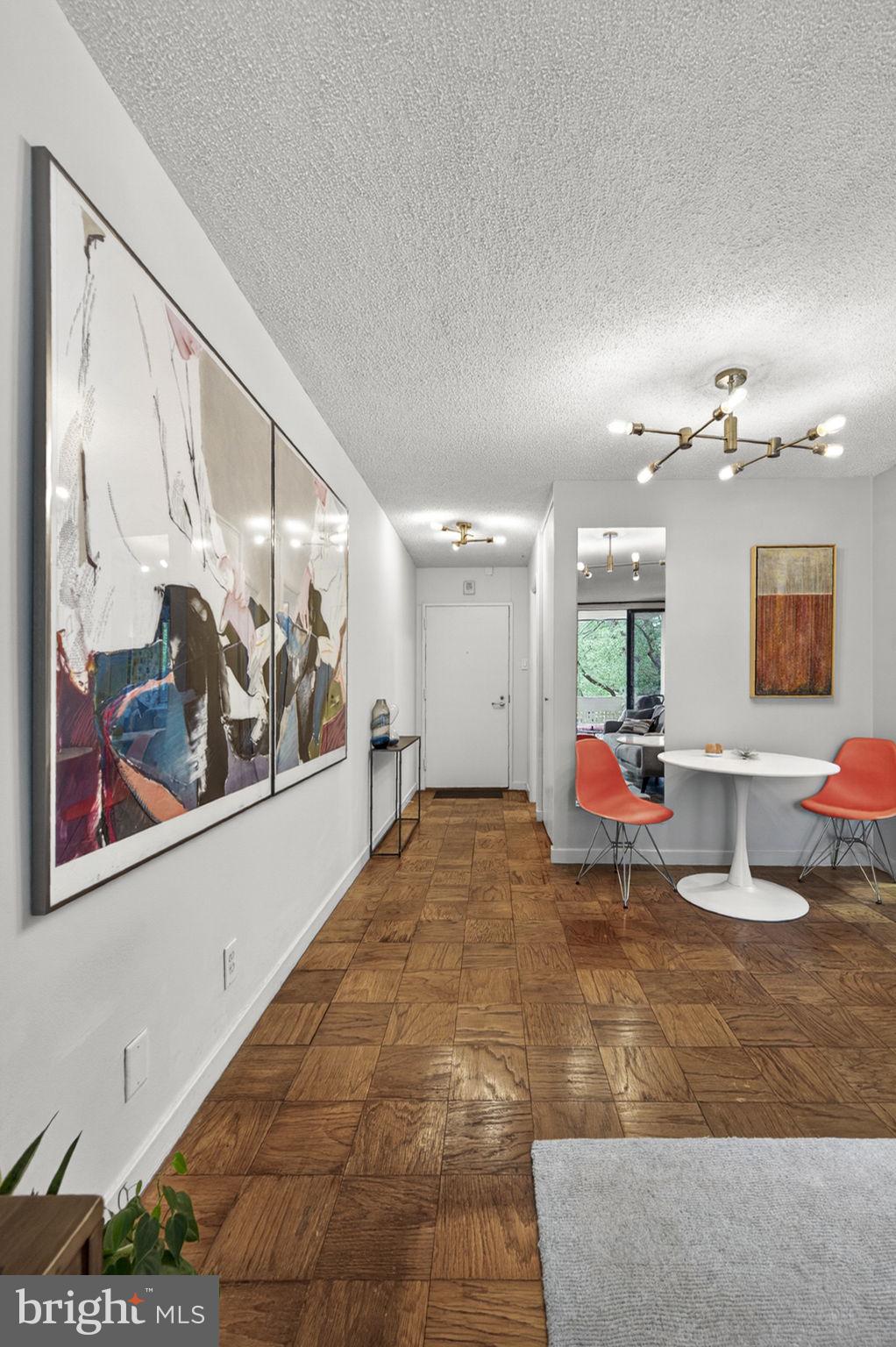 429 N Street Southwest, Unit S203 Washington, DC 20024 - Photo 18 of 28 a living room with furniture and a painting on the wall