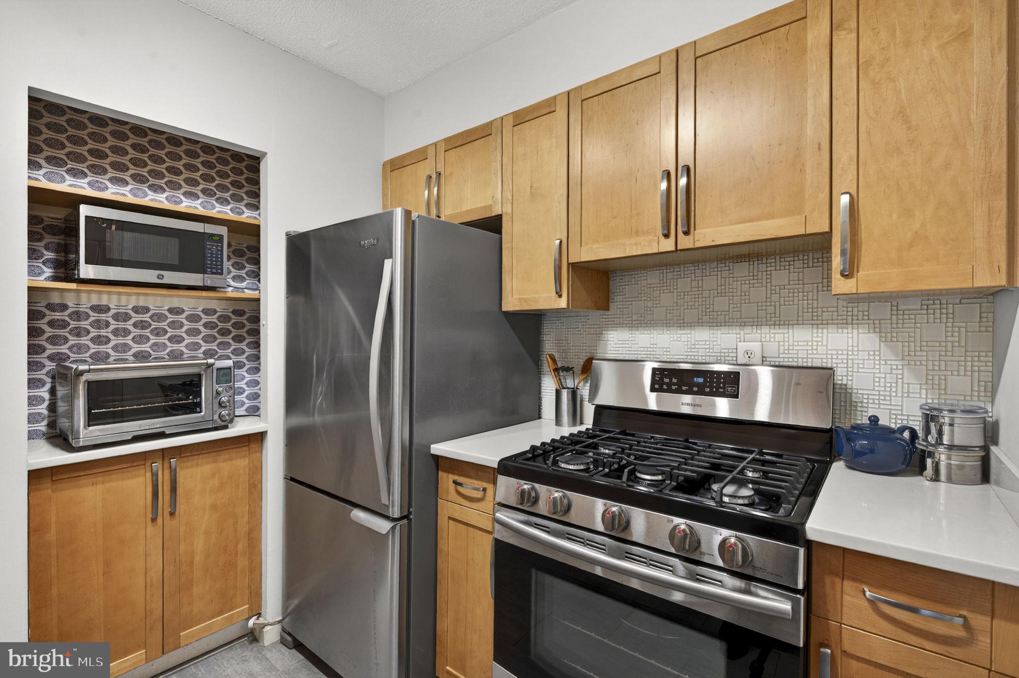 429 N Street Southwest, Unit S203 Washington, DC 20024 - Photo 9 of 28 a kitchen with a stove and a microwave