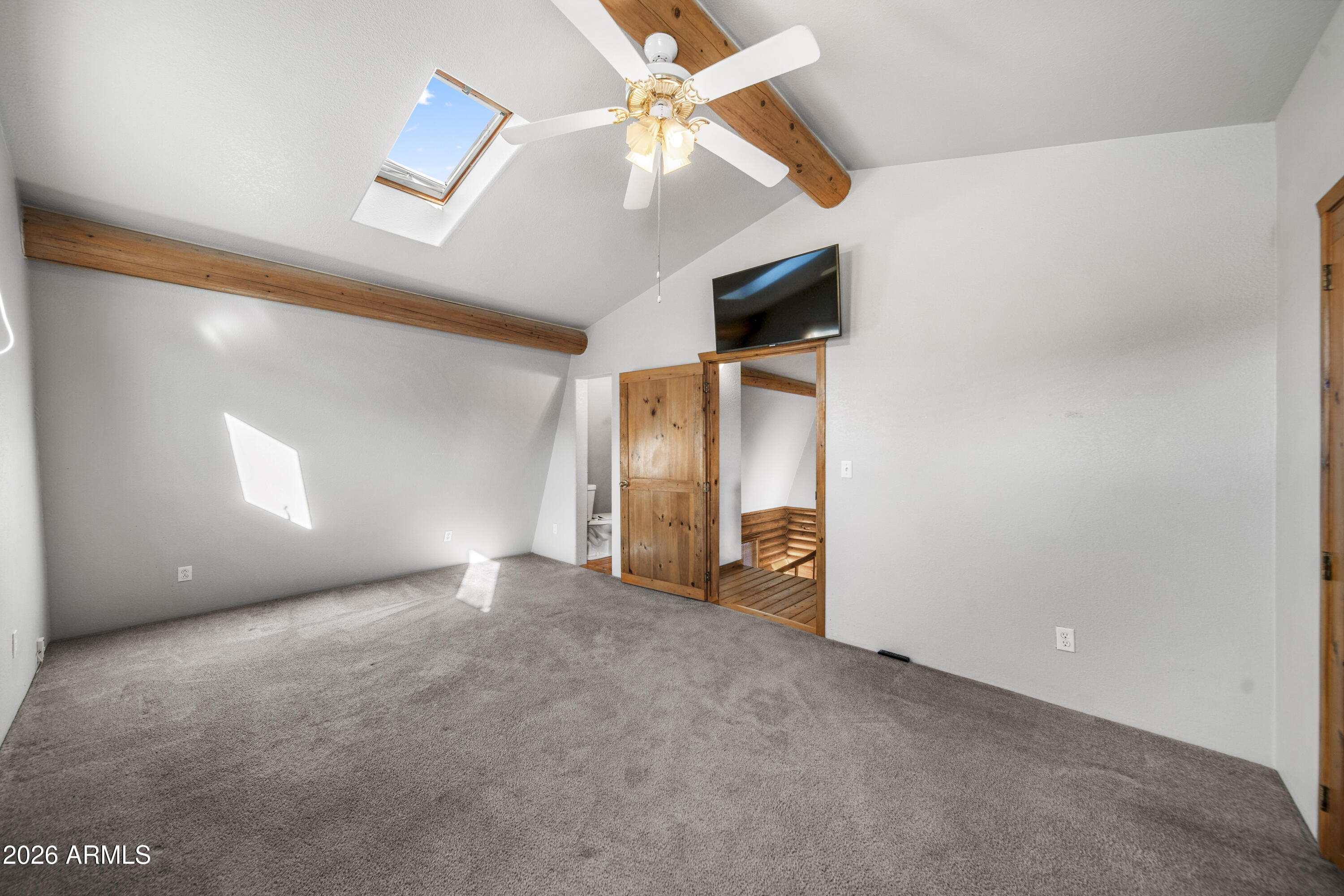 26162 Pecks Peak Road Kirkland, AZ 86332 - Photo 11 of 51 a view of an empty room with a ceiling fan