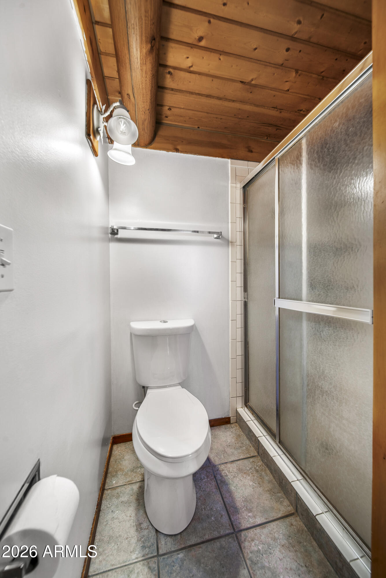 26162 Pecks Peak Road Kirkland, AZ 86332 - Photo 13 of 51 a bathroom with a toilet and a shower