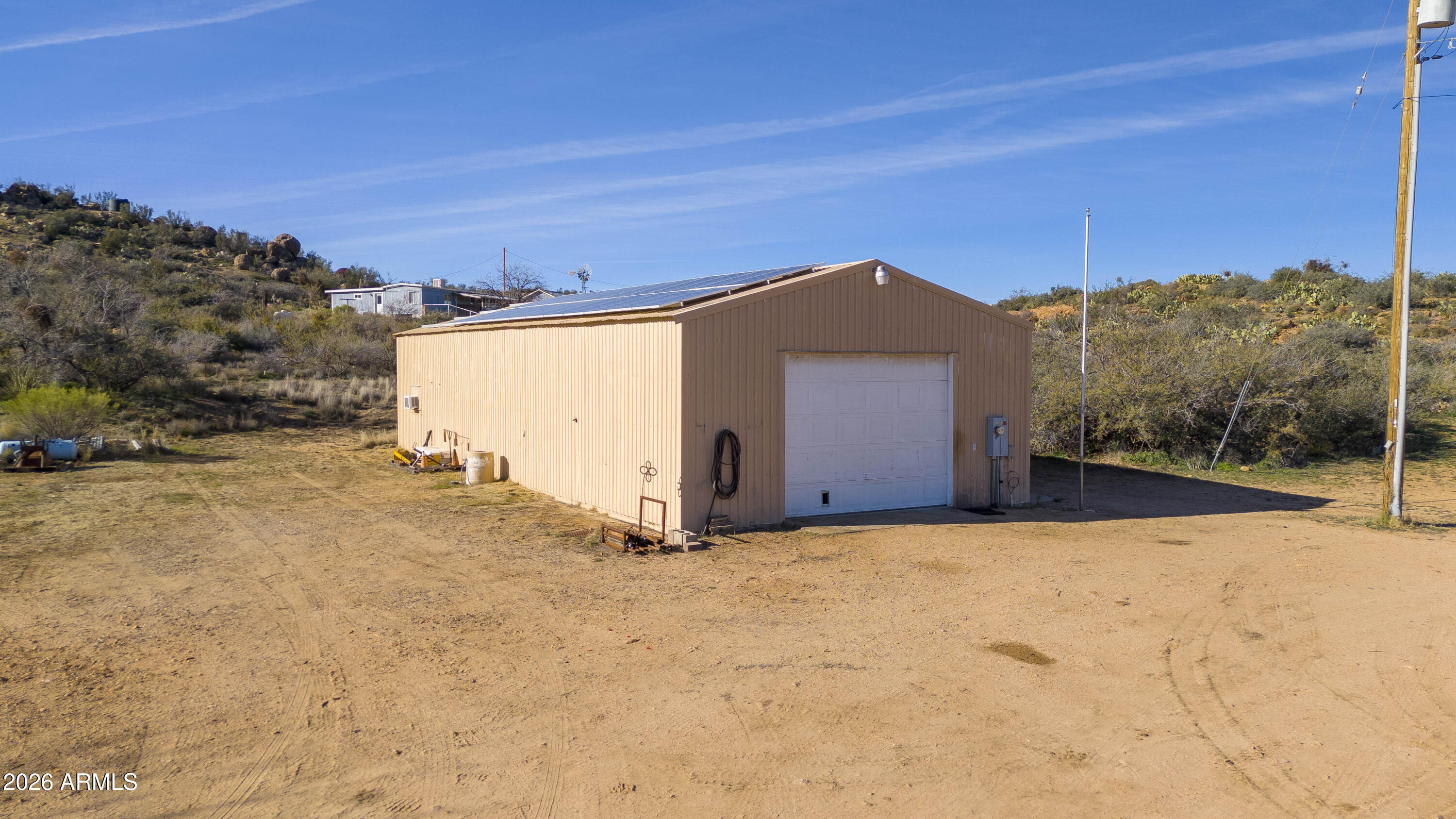 26162 Pecks Peak Road Kirkland, AZ 86332 - Photo 20 of 51 a view of a house with a yard