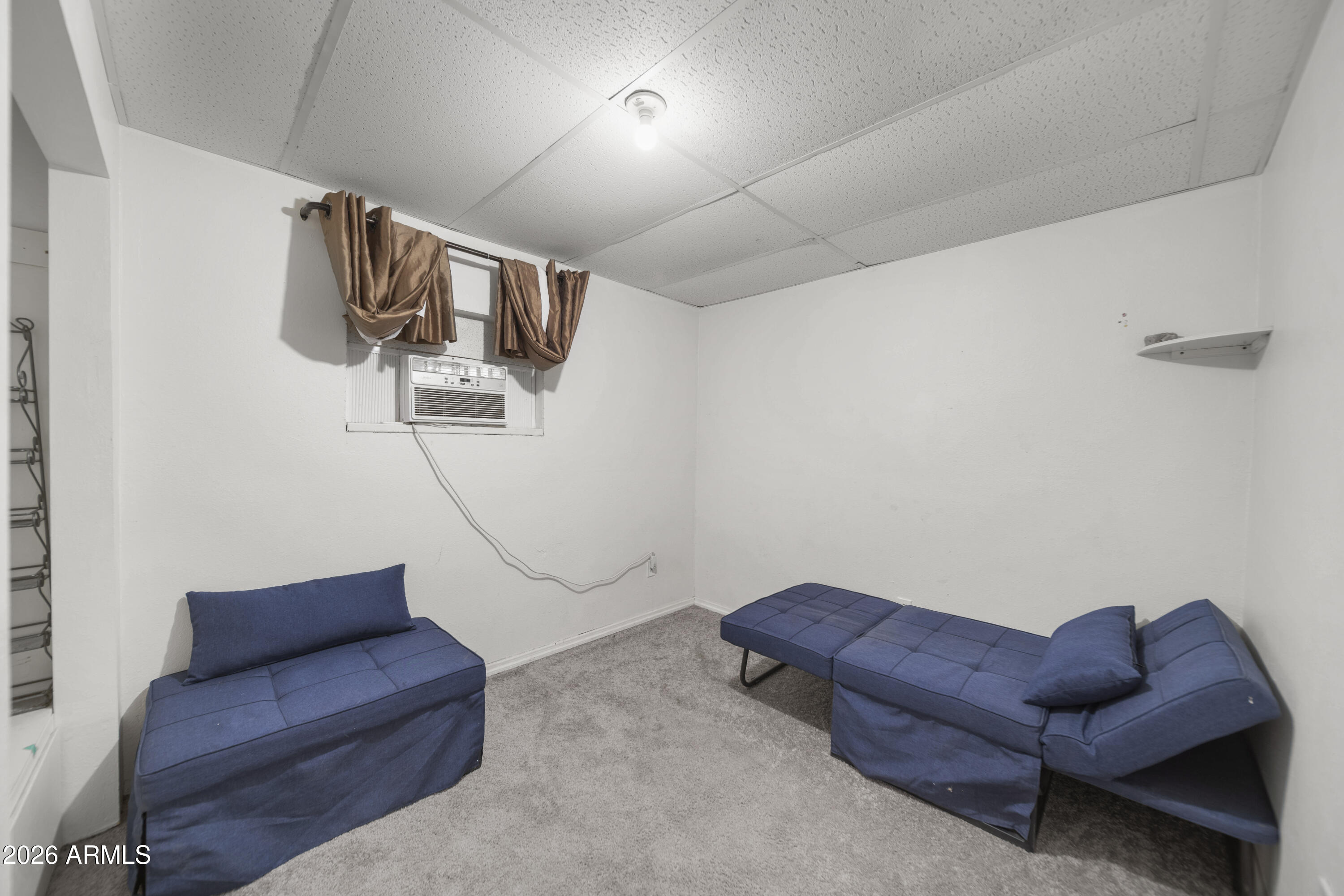 26162 Pecks Peak Road Kirkland, AZ 86332 - Photo 25 of 51 a living room with furniture and a window