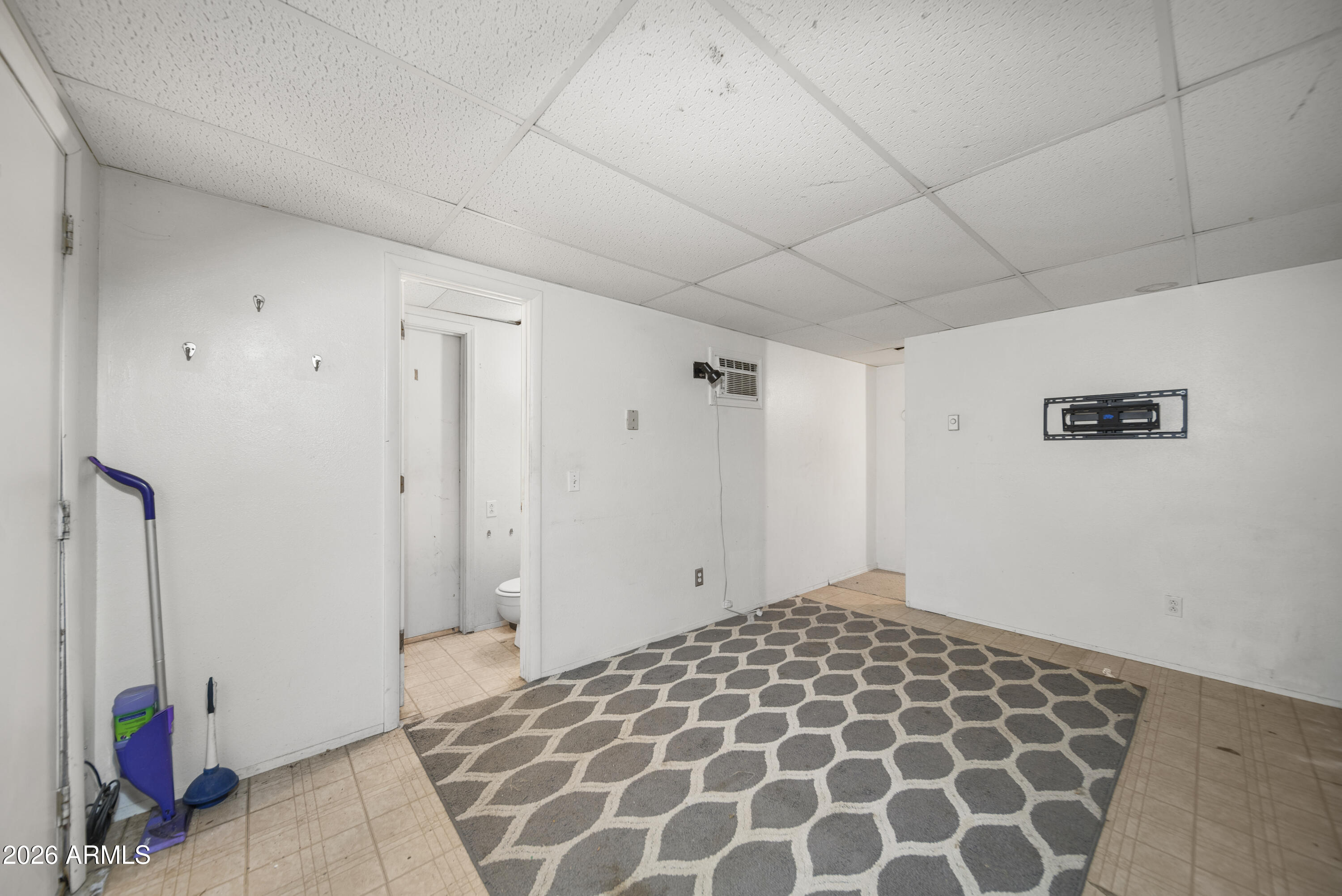 26162 Pecks Peak Road Kirkland, AZ 86332 - Photo 26 of 51 a bedroom with a bed and a cabinets