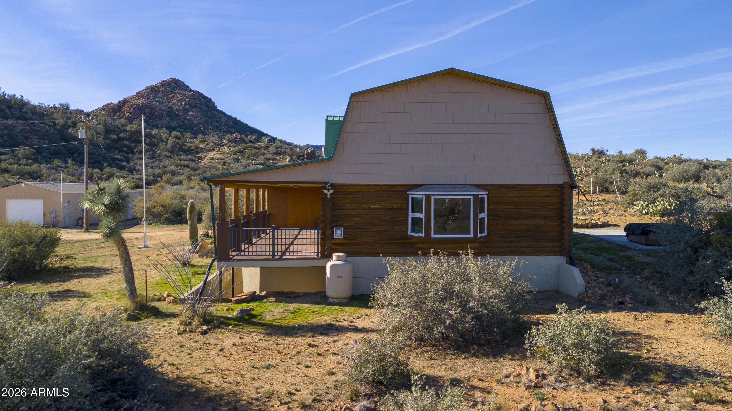 26162 Pecks Peak Road Kirkland, AZ 86332 - Photo 39 of 51 a front view of a house with garden