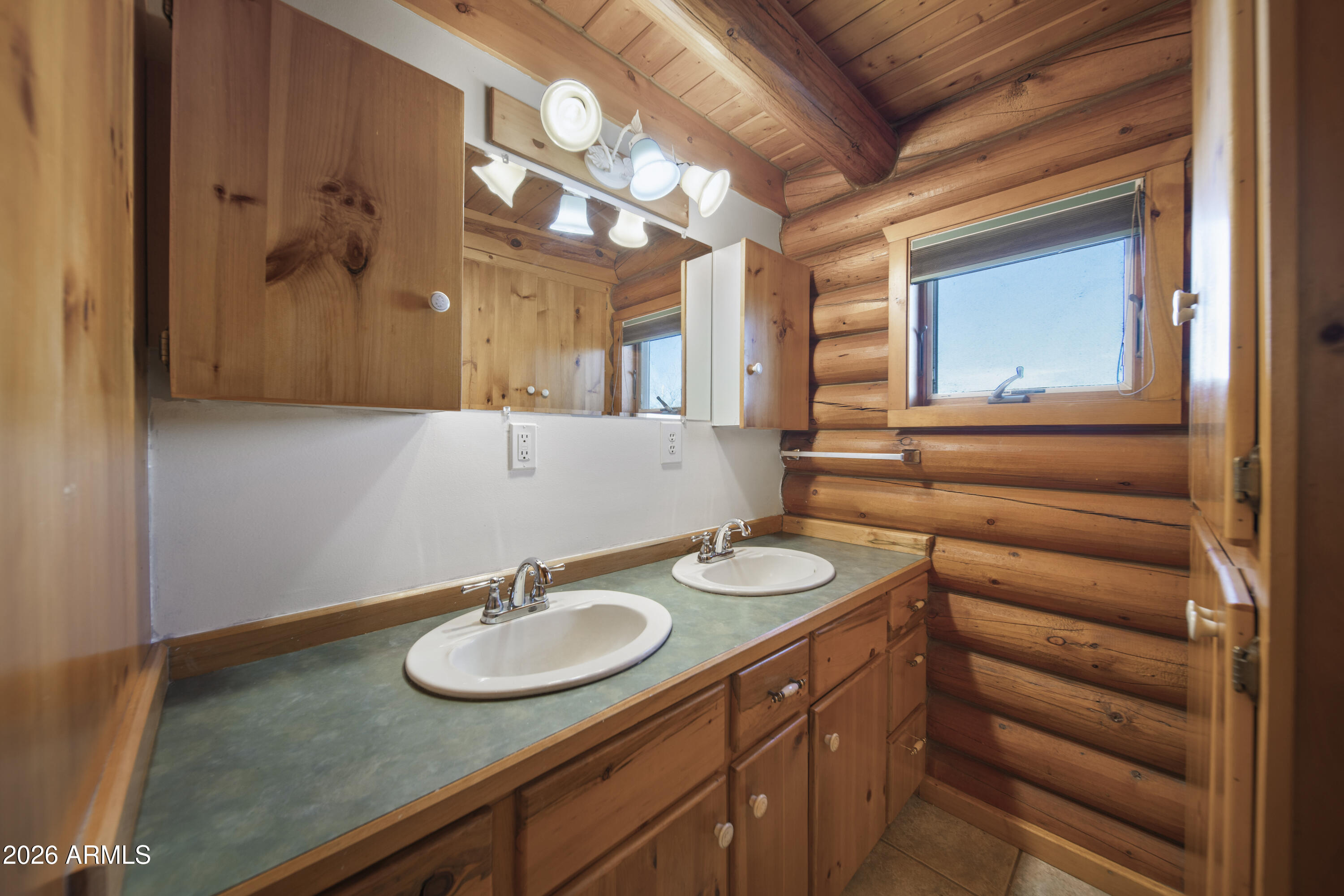 26162 Pecks Peak Road Kirkland, AZ 86332 - Photo 49 of 51 a bathroom with a sink and a mirror