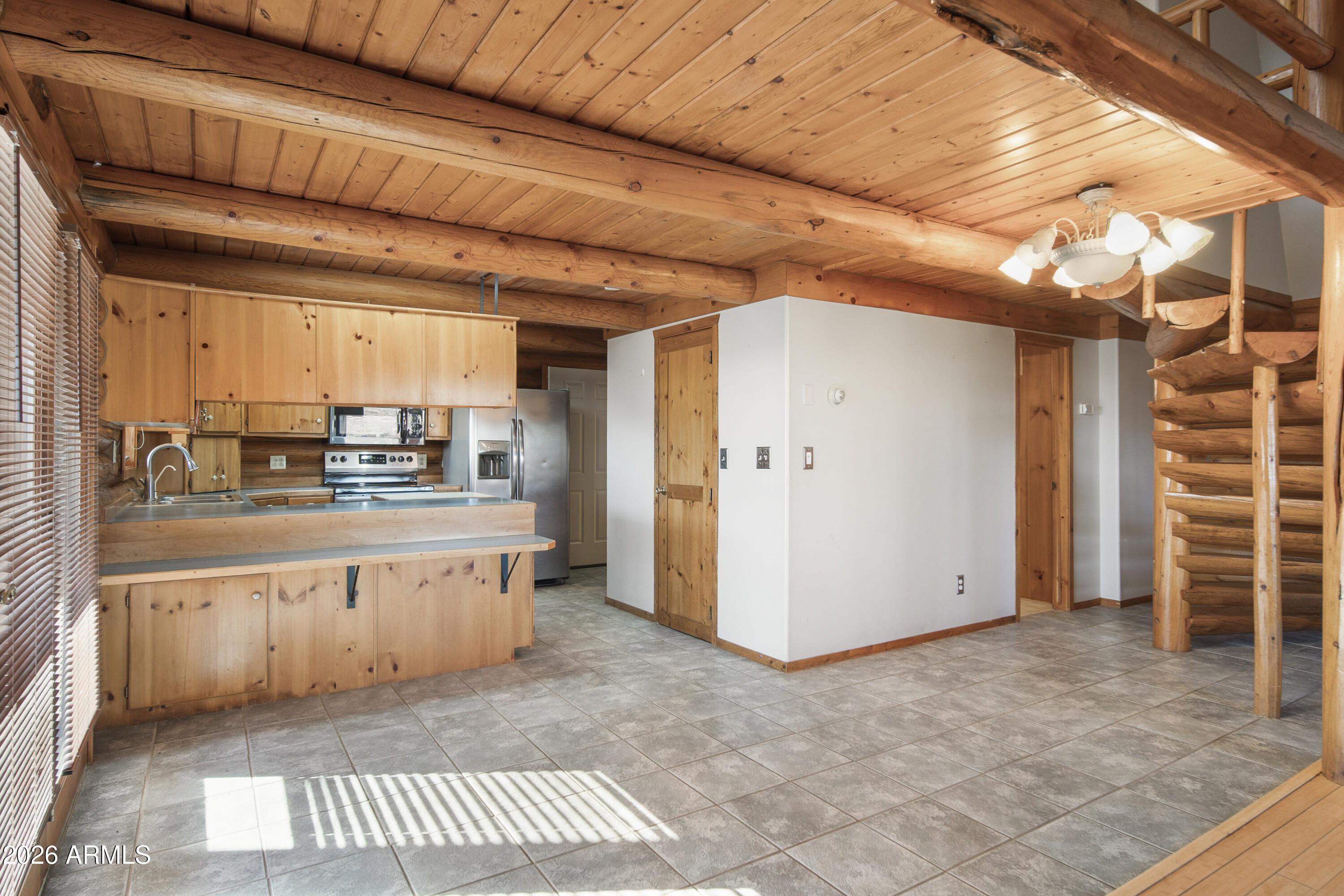 26162 Pecks Peak Road Kirkland, AZ 86332 - Photo 6 of 51 a kitchen with stainless steel appliances granite countertop a refrigerator and a stove