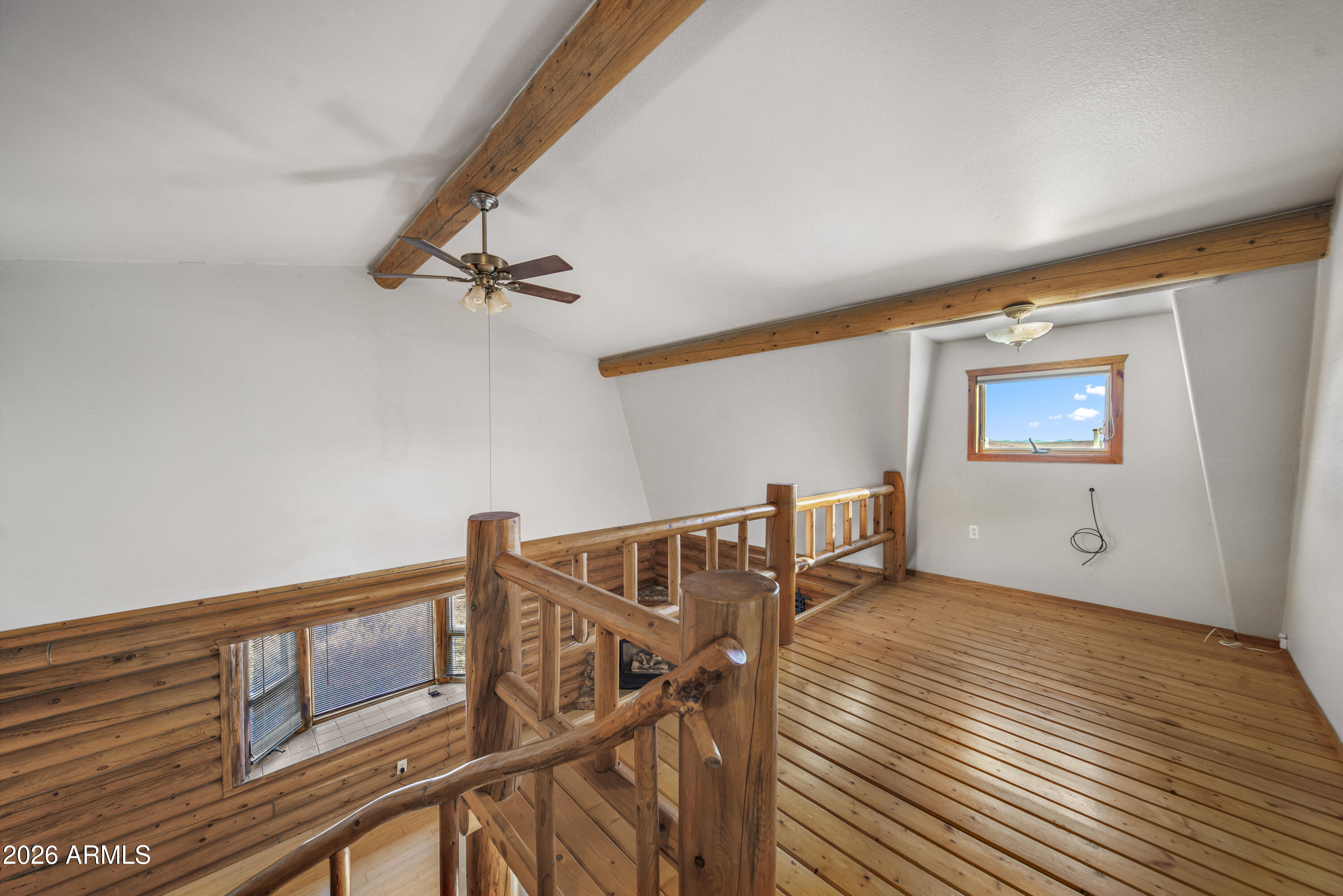 26162 Pecks Peak Road Kirkland, AZ 86332 - Photo 8 of 51 a view of an empty room with wooden floor