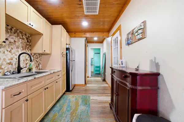 a kitchen with stainless steel appliances sink and cabinets