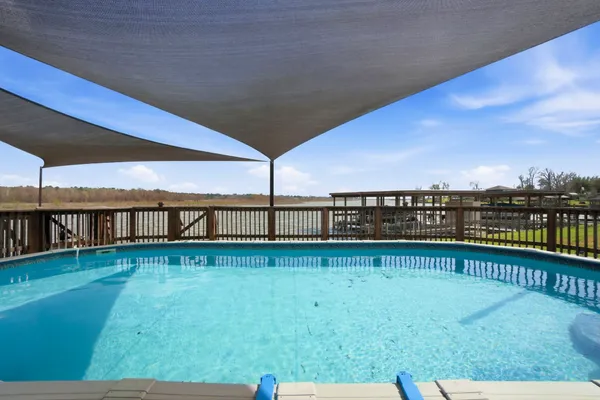 a view of a swimming pool with an outdoor seating