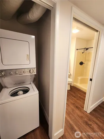 a view of a patio with table and chairs potted plants and a large tree