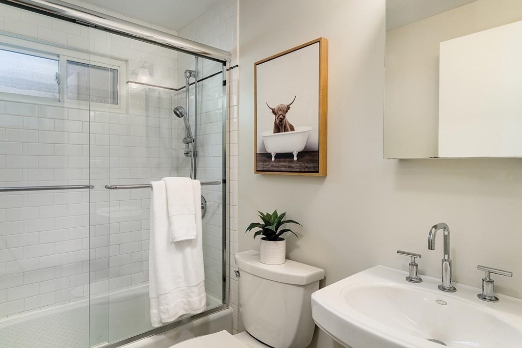 33 A Burroughs Street Boston, MA 02130 - Photo 13 of 15 a bathroom with a sink toilet and shower
