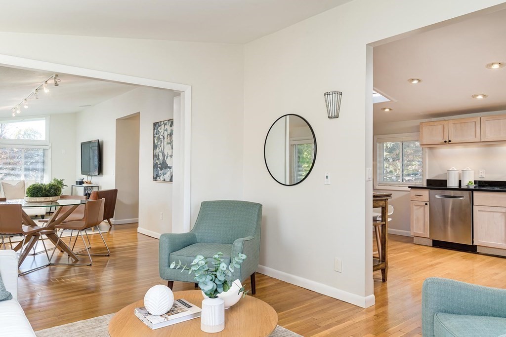 33 A Burroughs Street Boston, MA 02130 - Photo 4 of 15 a living room with furniture kitchen view and a wooden floor