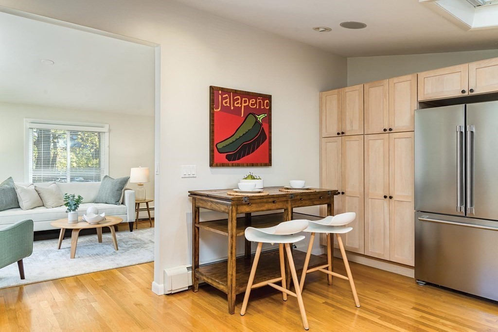 33 A Burroughs Street Boston, MA 02130 - Photo 7 of 15 a view of a dining room with furniture a kitchen and chandelier