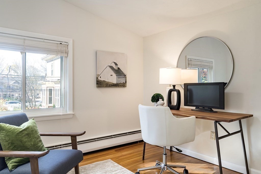 33 A Burroughs Street Boston, MA 02130 - Photo 8 of 15 a view of a workspace room with furniture and wooden floor