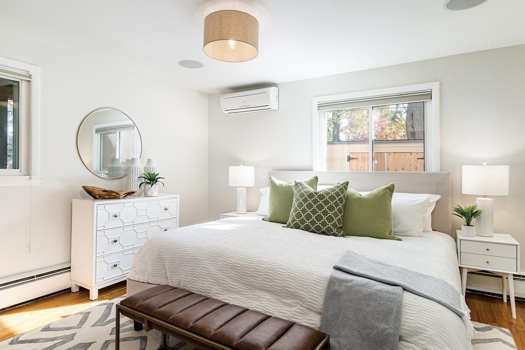 33 A Burroughs Street Boston, MA 02130 - Photo 9 of 15 a bedroom with a bed and wooden floor