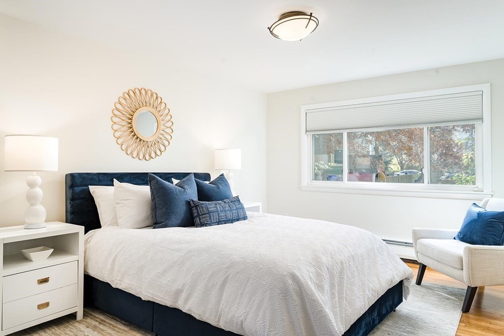 33 A Burroughs Street Boston, MA 02130 - Photo 10 of 15 a bedroom with a bed and a window