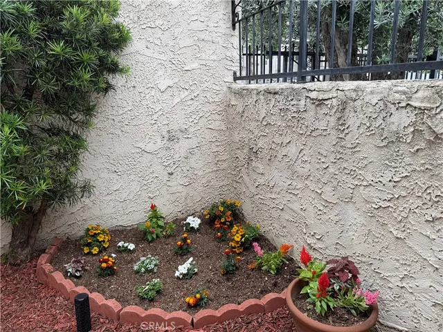 a view of a wooden bench in a backyard