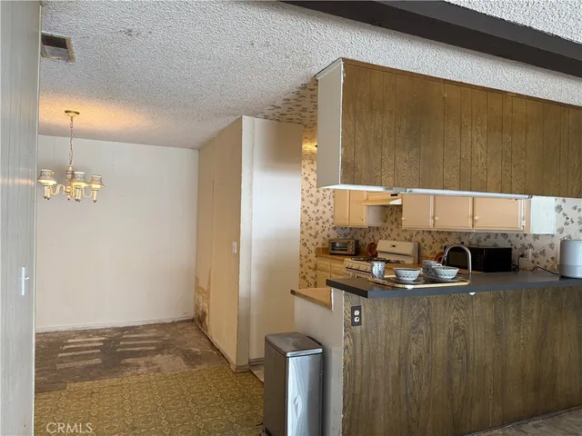 a kitchen with a sink and a refrigerator