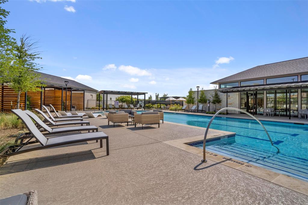 651 Watters Road, Unit 5305 Allen, TX 75013 - Photo 32 of 40 a swimming pool with outdoor seating and yard