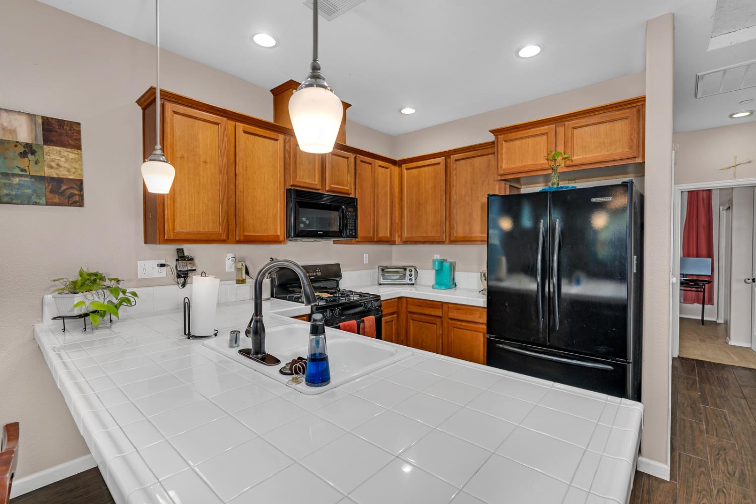 1116 West Walter Avenue, Unit 72 Fowler, CA 93625 - Photo 11 of 31 a kitchen with stainless steel appliances a refrigerator sink and stove