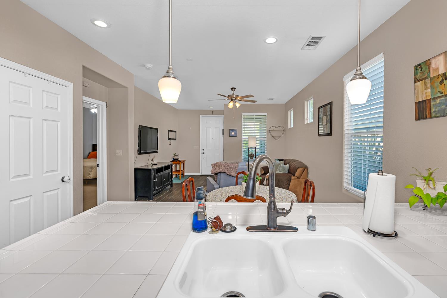 1116 West Walter Avenue, Unit 72 Fowler, CA 93625 - Photo 13 of 31 a bedroom with furniture and a chandelier