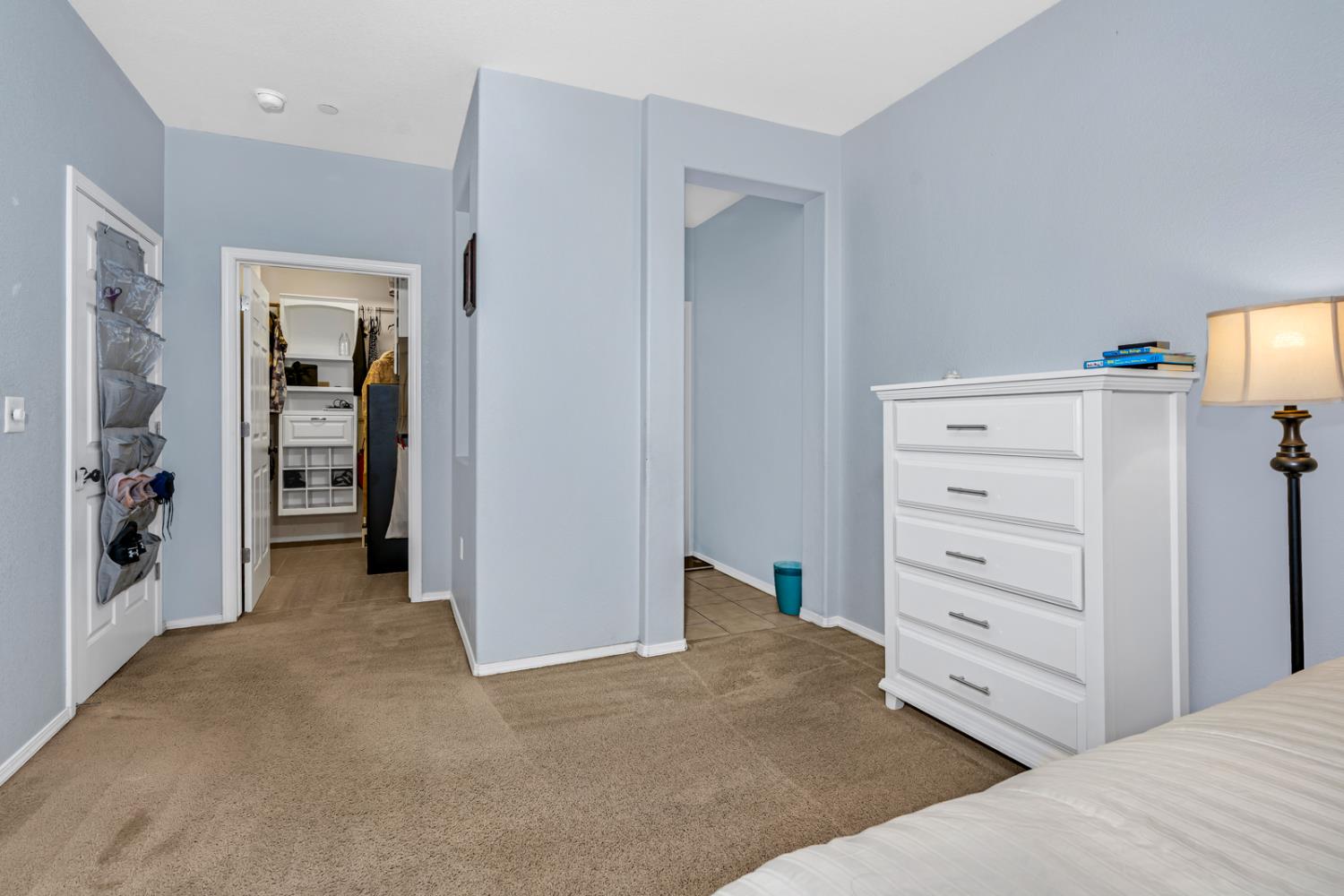 1116 West Walter Avenue, Unit 72 Fowler, CA 93625 - Photo 15 of 31 a view of a bedroom with closet and cabinet