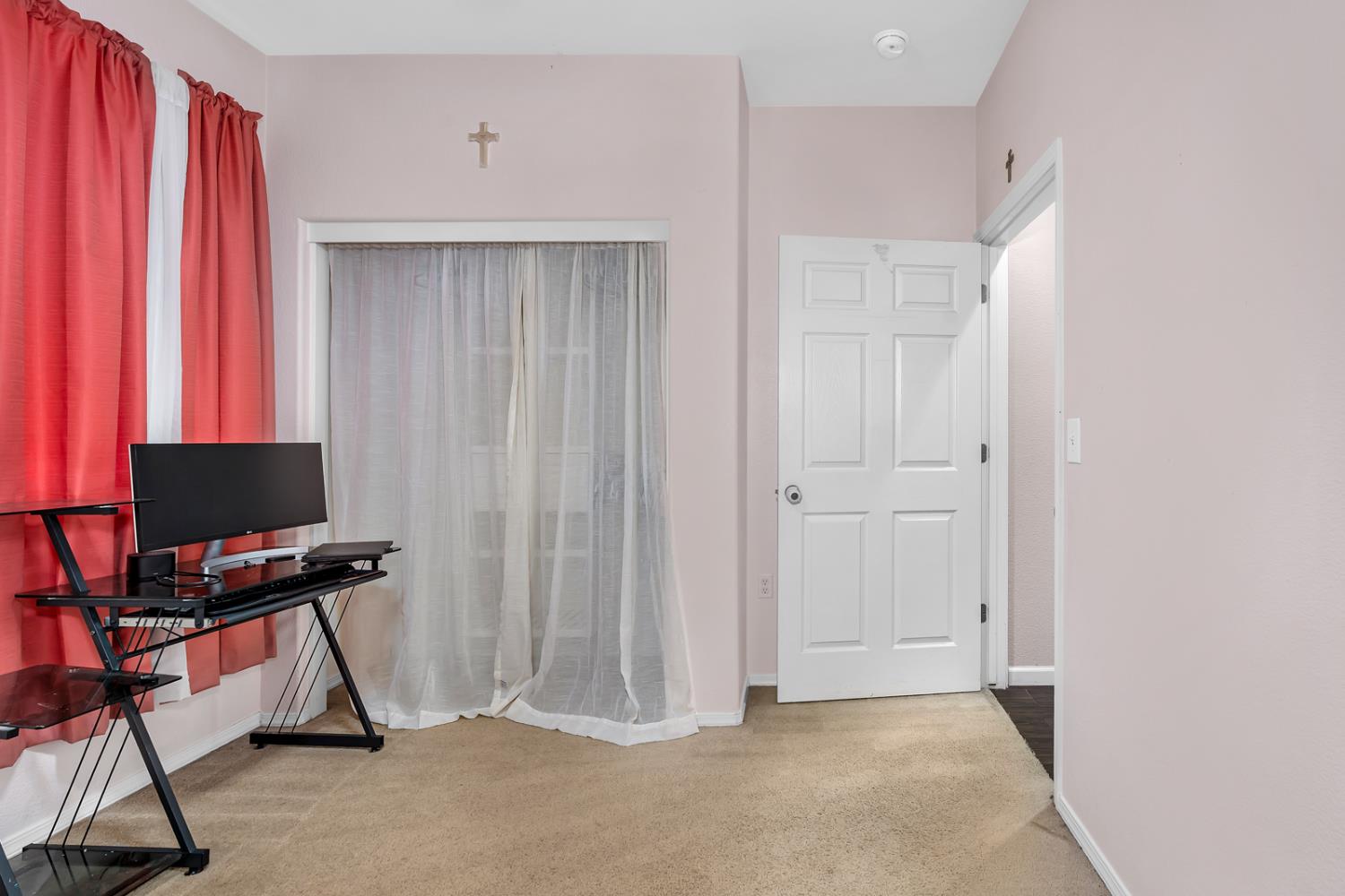 1116 West Walter Avenue, Unit 72 Fowler, CA 93625 - Photo 18 of 31 a view of a workspace with furniture and a window