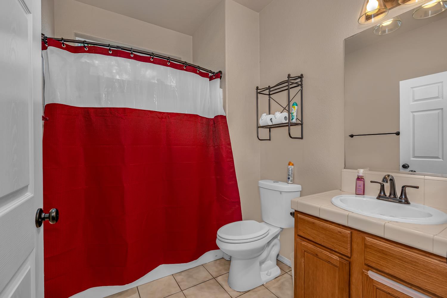 1116 West Walter Avenue, Unit 72 Fowler, CA 93625 - Photo 21 of 31 a bathroom with a toilet and a sink