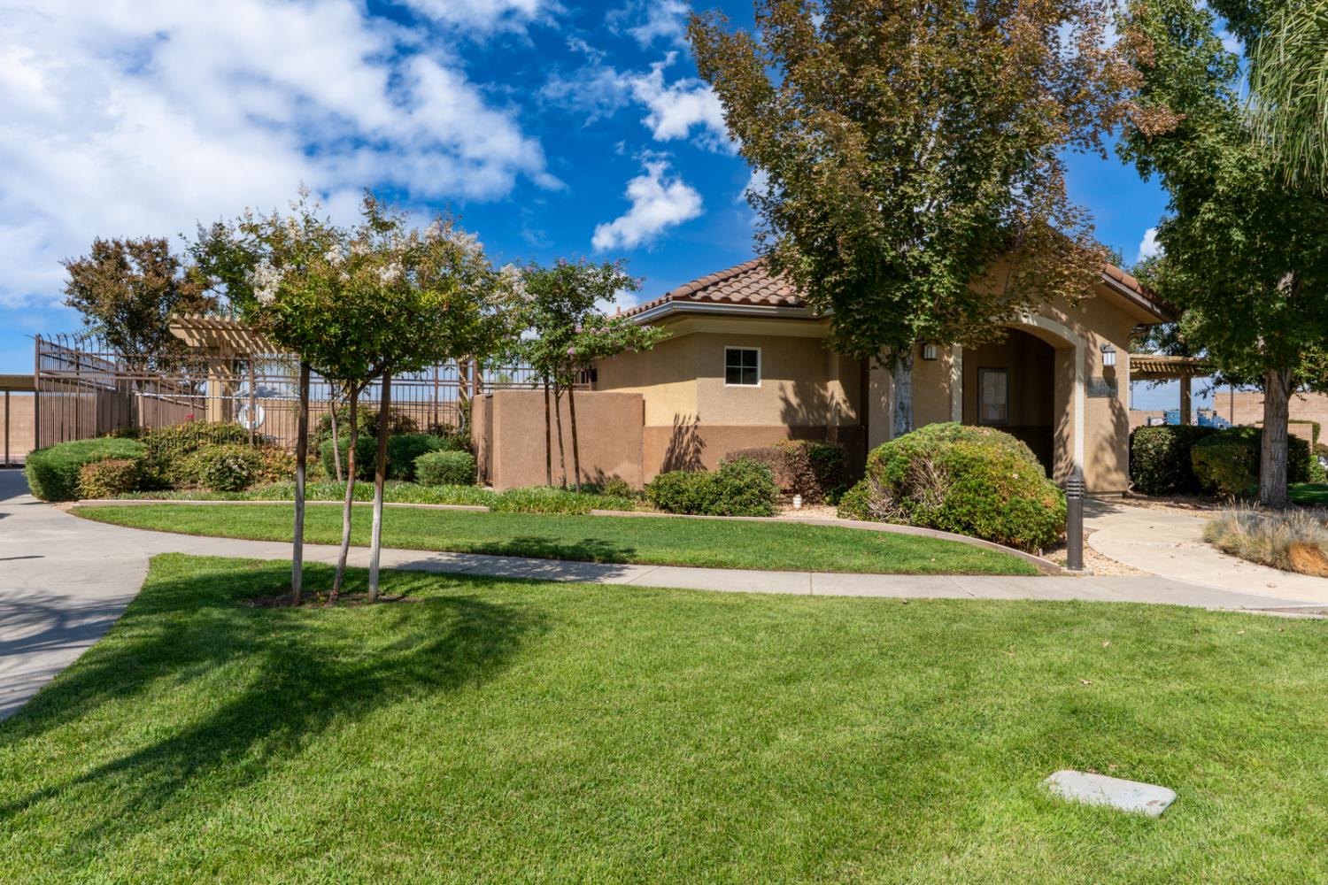 1116 West Walter Avenue, Unit 72 Fowler, CA 93625 - Photo 23 of 31 a view of a house with a backyard