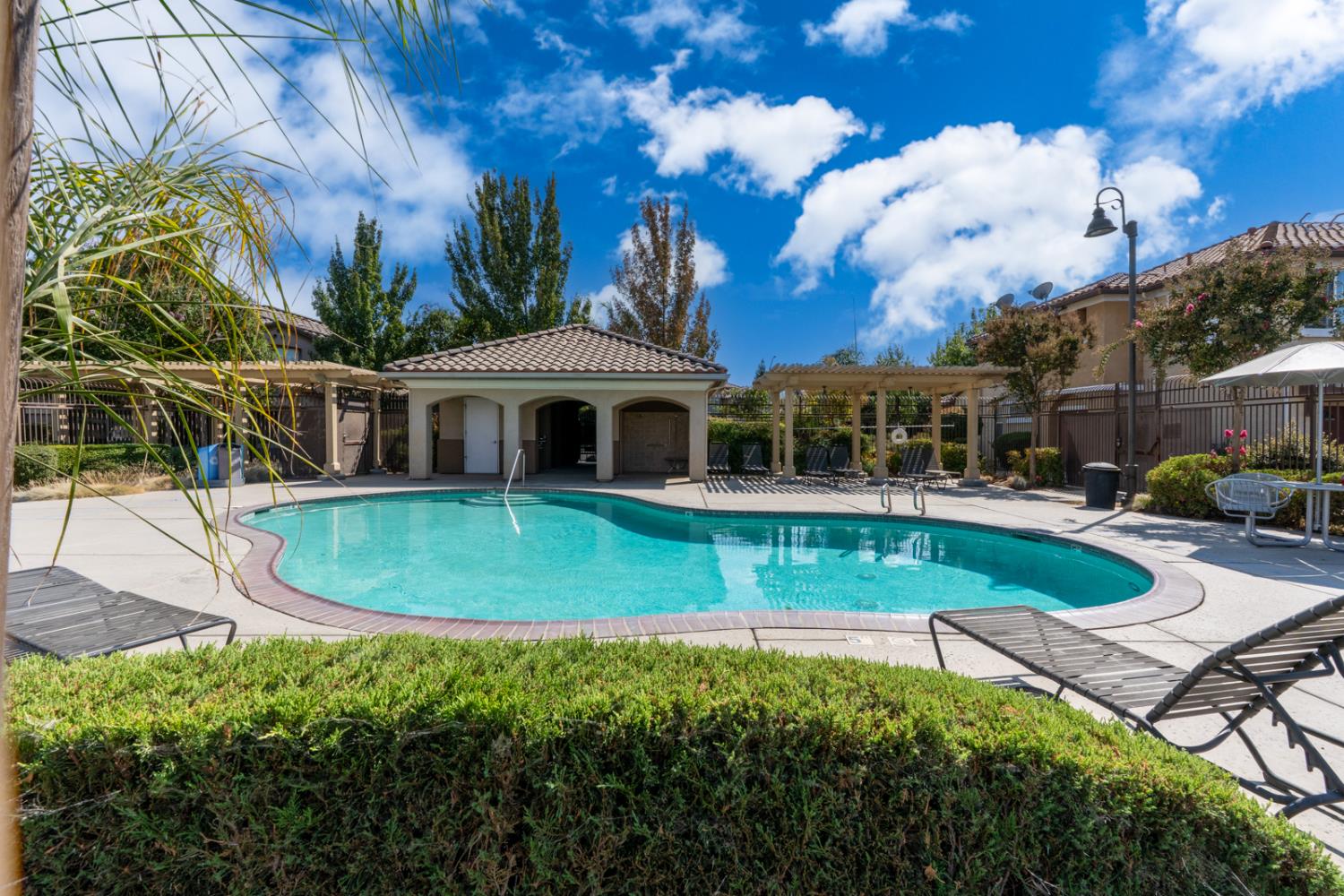 1116 West Walter Avenue, Unit 72 Fowler, CA 93625 - Photo 25 of 31 a view of a house with swimming pool
