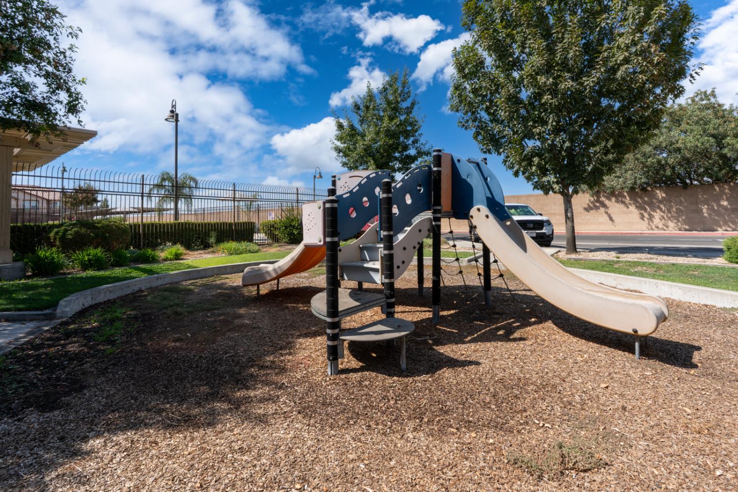 1116 West Walter Avenue, Unit 72 Fowler, CA 93625 - Photo 28 of 31 a view of a park with slide