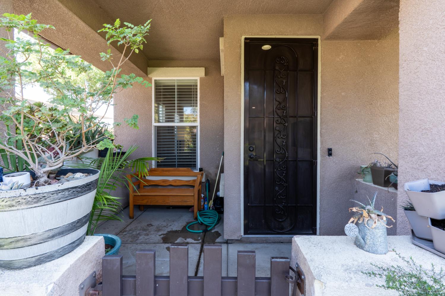 1116 West Walter Avenue, Unit 72 Fowler, CA 93625 - Photo 4 of 31 a living room with furniture and a potted plant