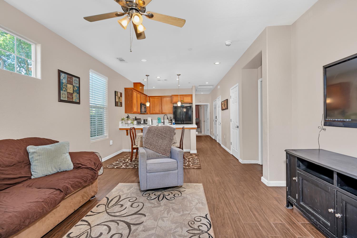 1116 West Walter Avenue, Unit 72 Fowler, CA 93625 - Photo 6 of 31 a living room with furniture and a flat screen tv