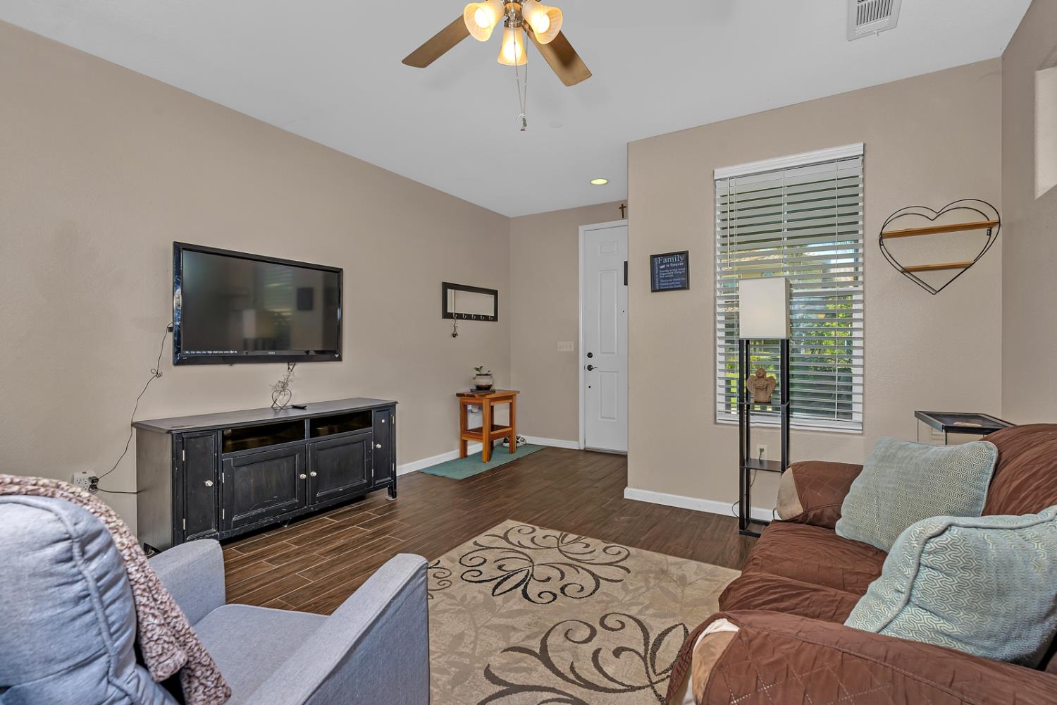 1116 West Walter Avenue, Unit 72 Fowler, CA 93625 - Photo 7 of 31 a living room with furniture and a flat screen tv