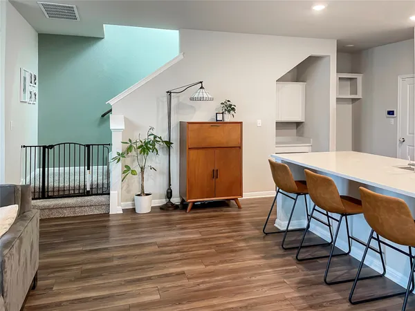 a workspace with furniture window and wooden floor