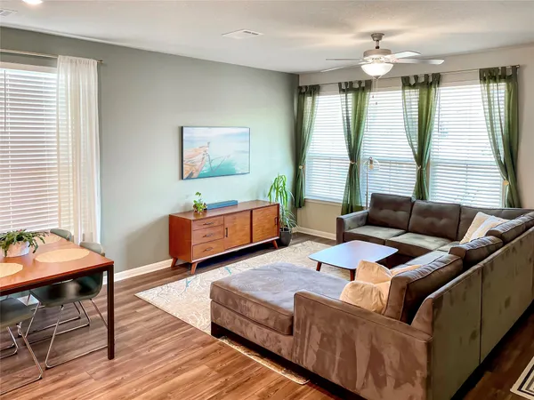 a living room with furniture and a large window