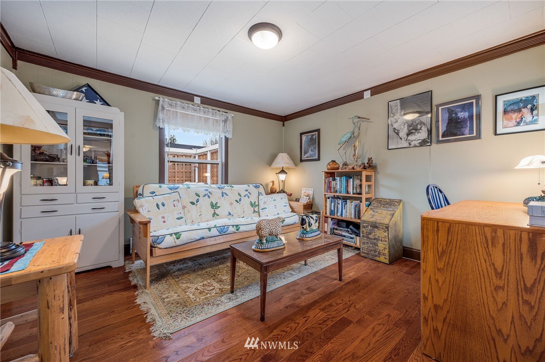 1022 North 32nd Street Renton, WA 98056 - Photo 16 of 29 a living room with furniture and a wooden floor