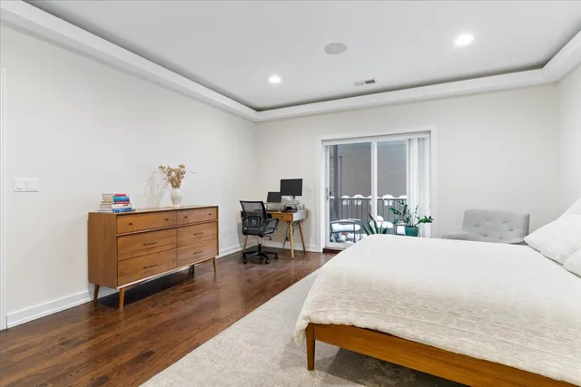 a bed room with a bed window and a chair