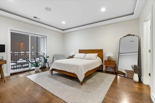 a bedroom with a large bed and a dresser