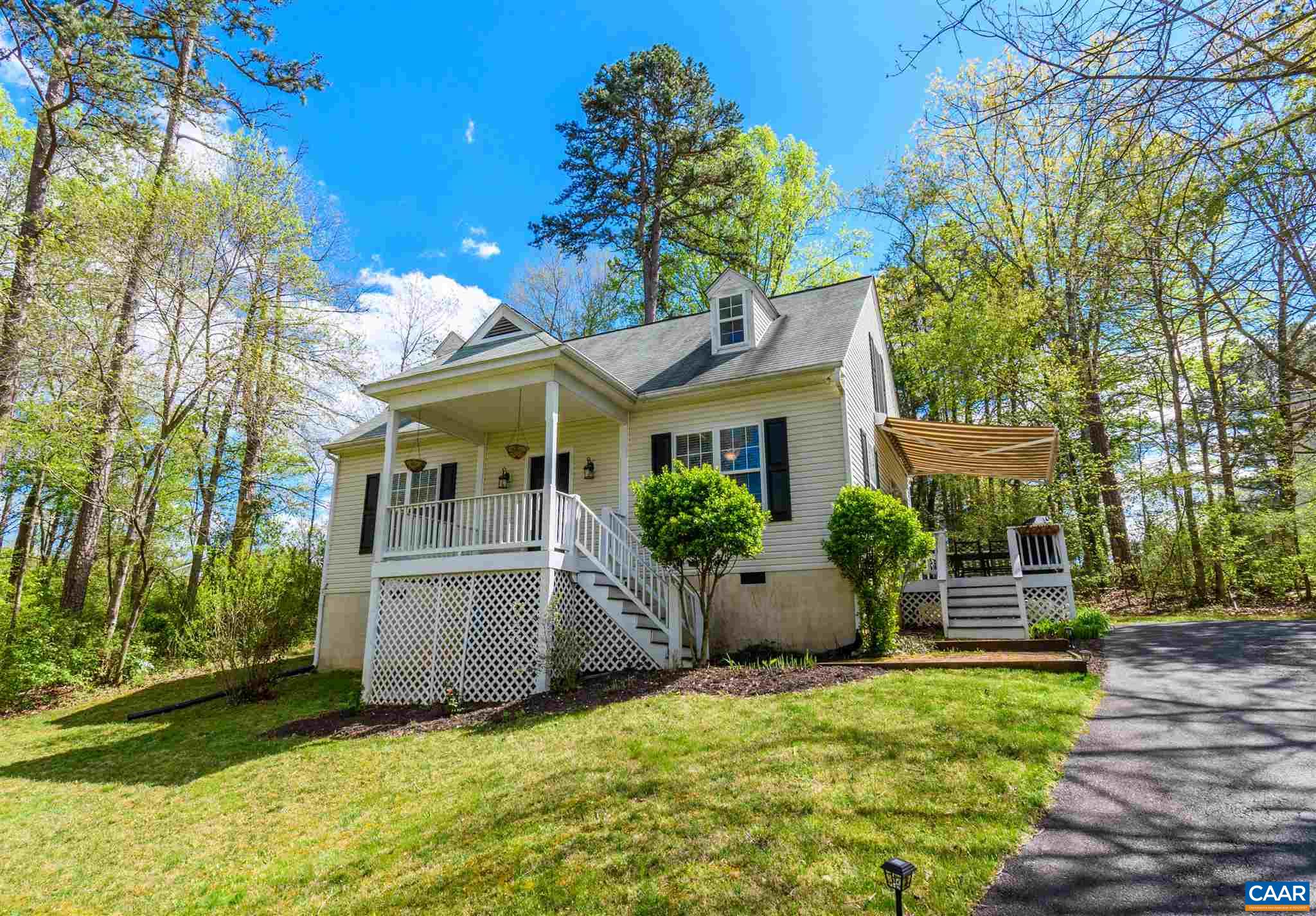 322 East Daffodil Road Ruckersville, VA 22968 - Photo 1 of 28 a front view of a house with a garden