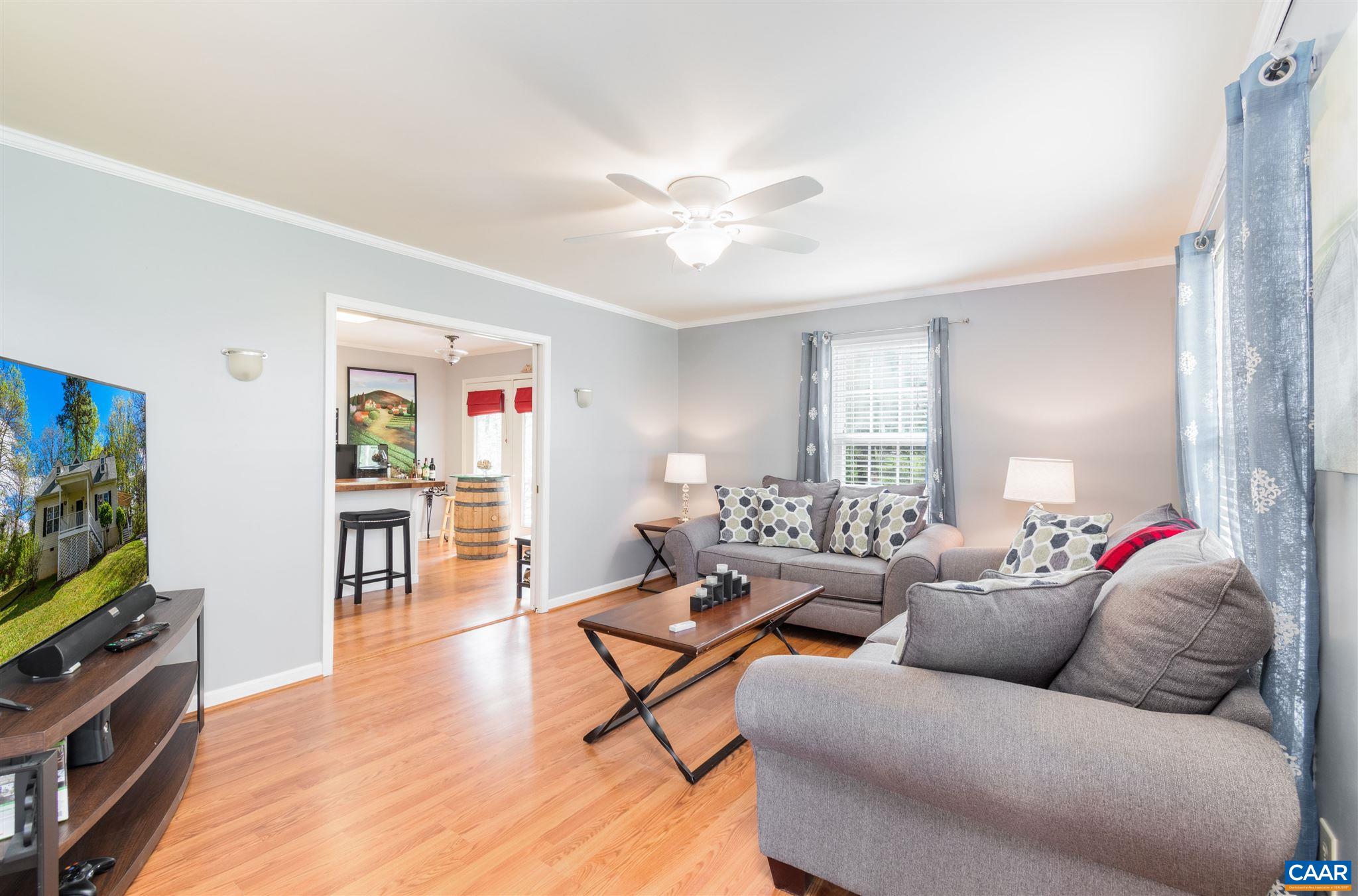 322 East Daffodil Road Ruckersville, VA 22968 - Photo 13 of 28 a living room with furniture and a flat screen tv