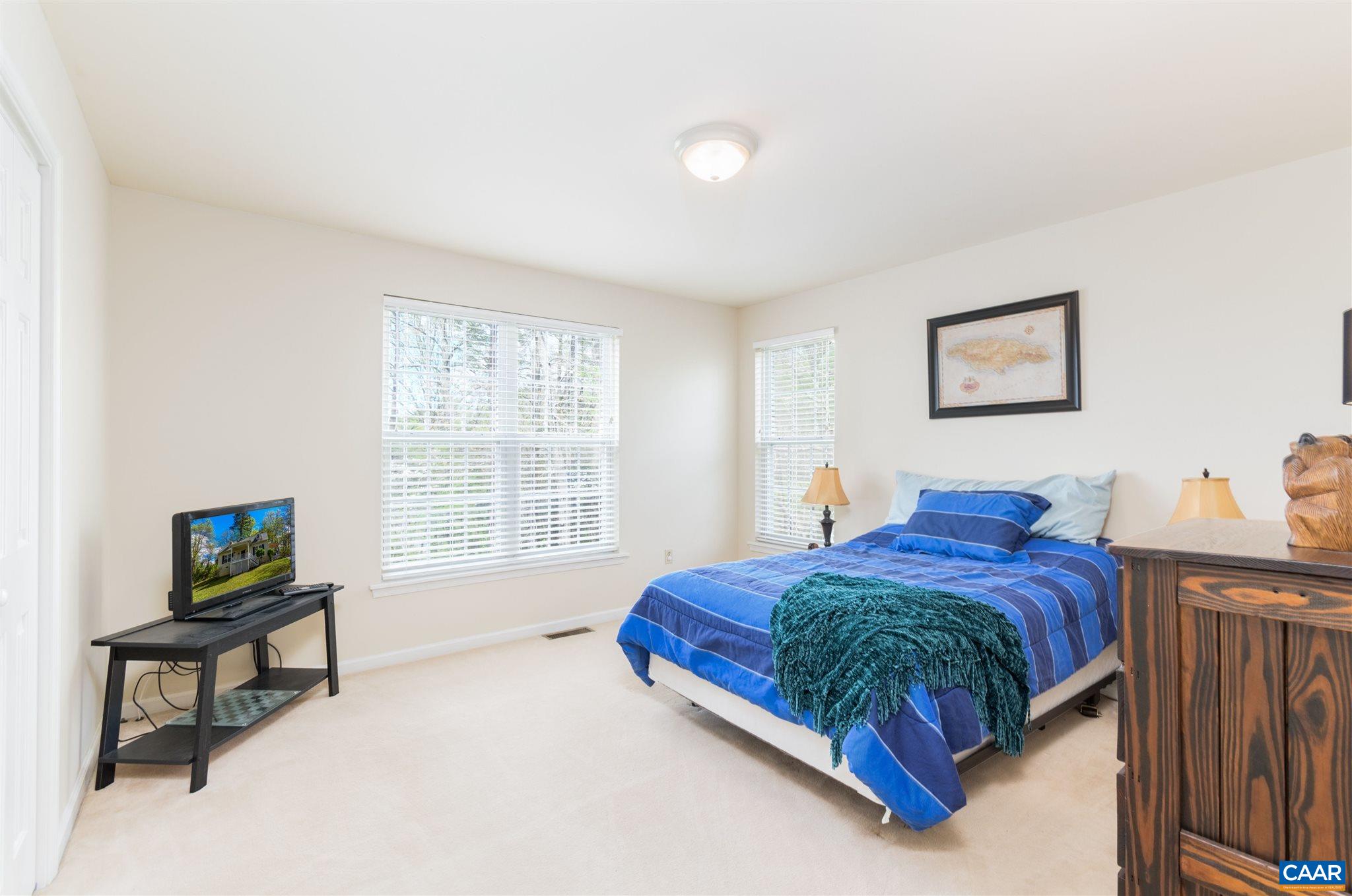 322 East Daffodil Road Ruckersville, VA 22968 - Photo 15 of 28 a bedroom with a bed and a window