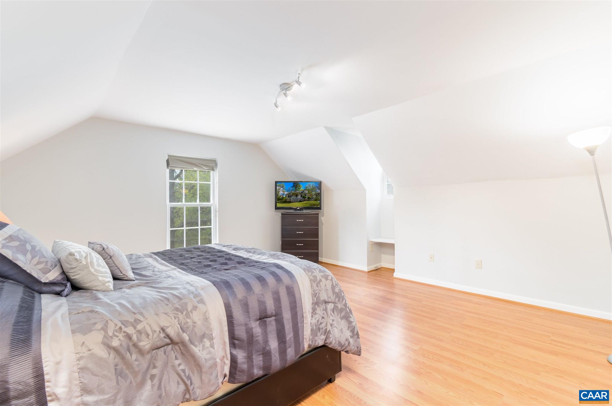 322 East Daffodil Road Ruckersville, VA 22968 - Photo 21 of 28 a spacious bedroom with a bed and a window