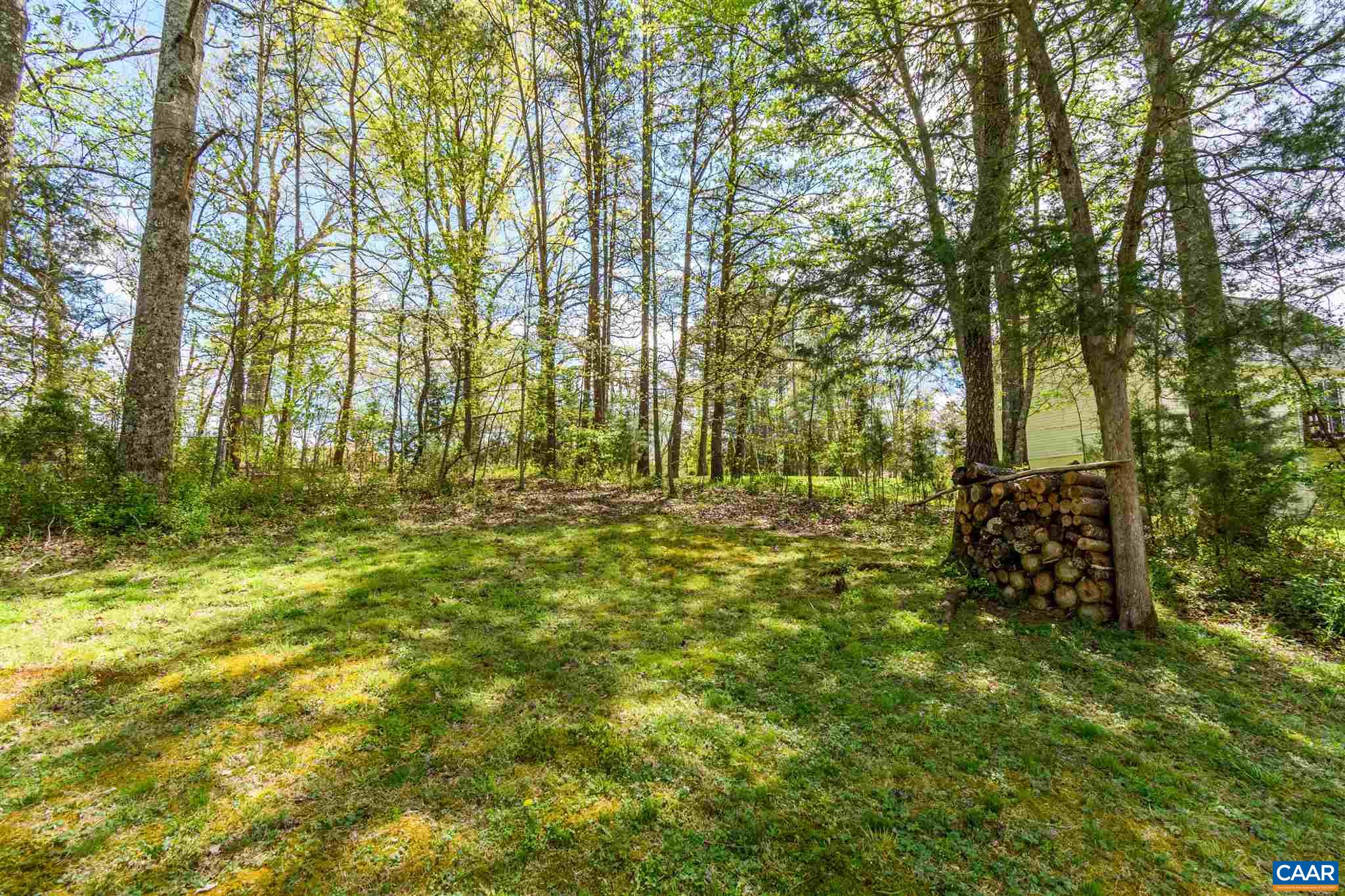 322 East Daffodil Road Ruckersville, VA 22968 - Photo 6 of 28 a large yard with lots of green space and house in the back