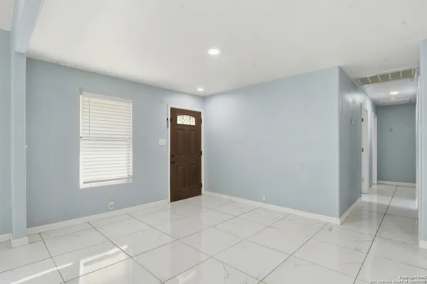 a view of an empty room and window