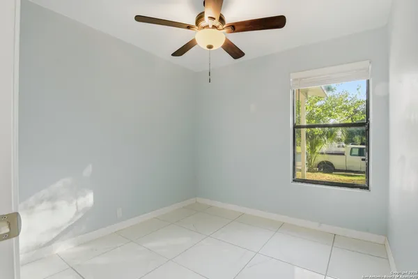 a view of an empty room with a window